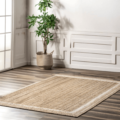 Harmony border braided jute rug in a sunlit room with a cream inset border